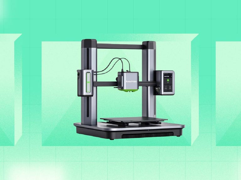 An Anker 3D printer against a green background.