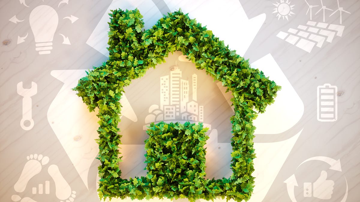 A frame of a house created with green leaves is overlaid on symbols of recycling, solar panels, repairs and electricity