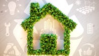A frame of a house created with green leaves is overlaid on symbols of recycling, solar panels, repairs and electricity
