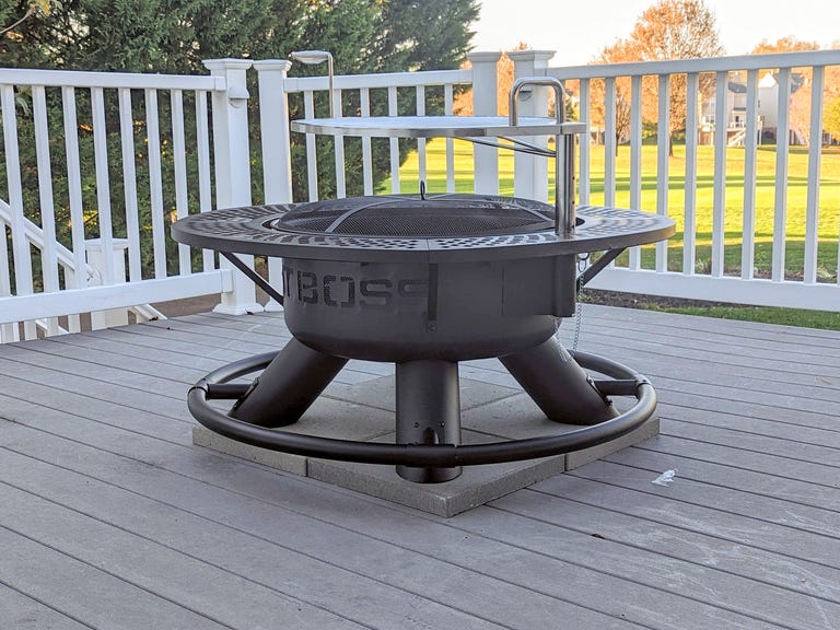 Black Fire pit with silver grill above