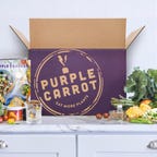 purple carrot meal kit on table next to box